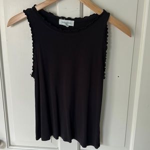 Black ribbed tank top with feminine ruffles